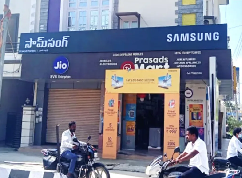Samsung and Jio backlit boards at Prasad Mart, Tirupati
