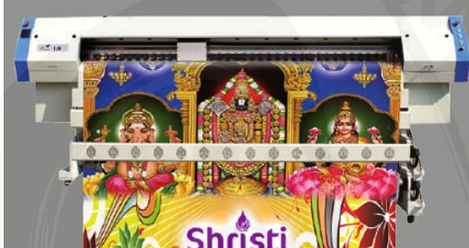JHF Leopard A16 large-format flex printer with a freshly printed devotional banner at the Shristi production unit